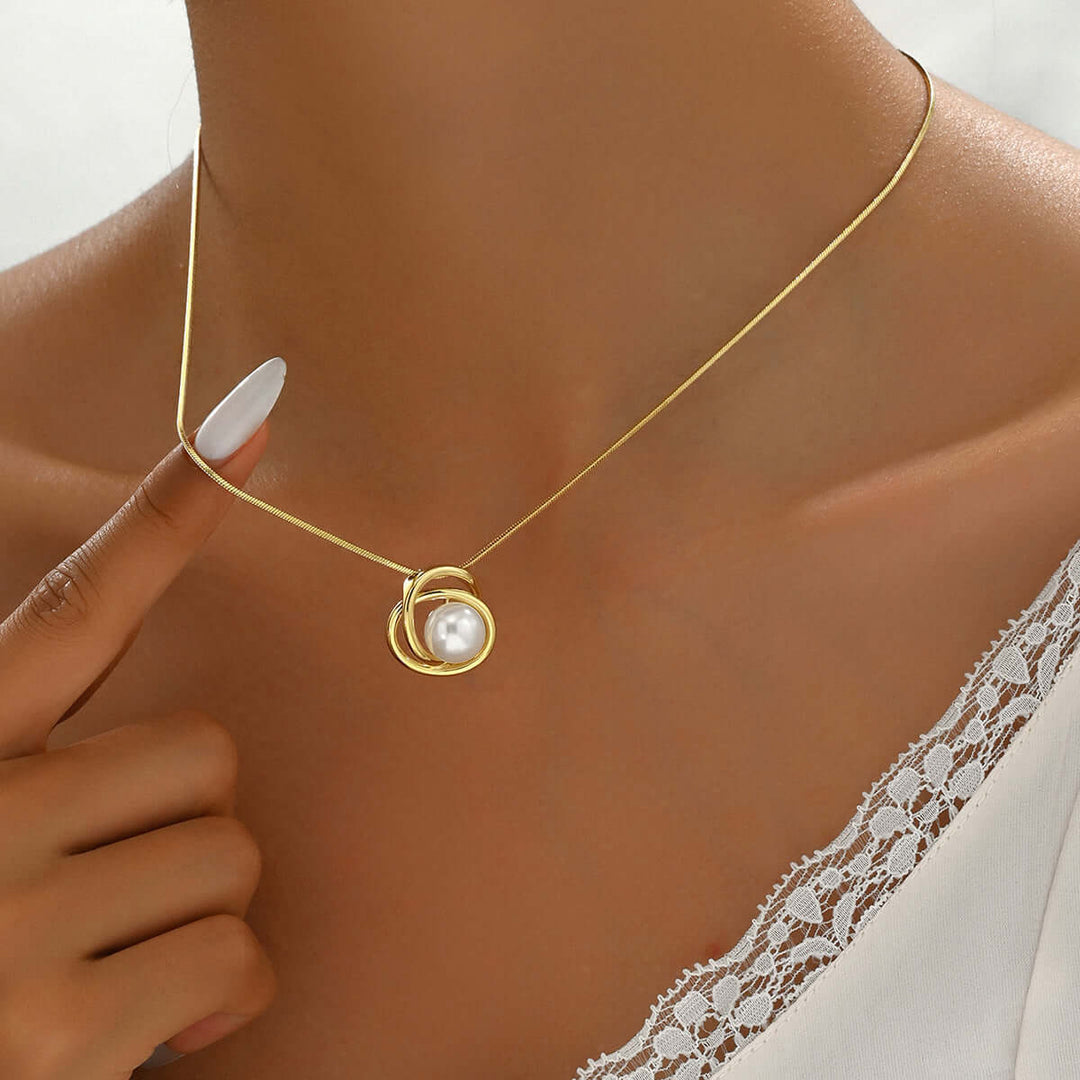 Sexy trendy women's necklace with pearl inlay, geometric pendant, and copper material. Elegant jewelry for stylish females.